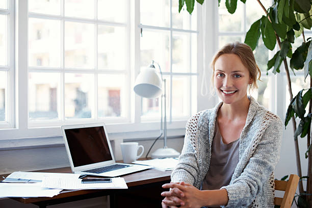 Professional woman working from a home office, representing a successful home-based business and remote entrepreneurship in the United States.