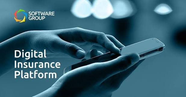 Digital insurance platform concept showing hands using a smartphone with insurance technology and online service graphics. 