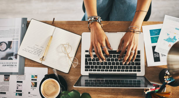 Professional working from home on a laptop, managing a service-based side hustle with business planning, digital marketing, and online client work.