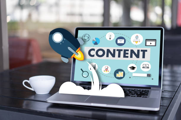 Laptop displaying a content marketing dashboard with digital media, education, email, and social media icons representing online content creation.