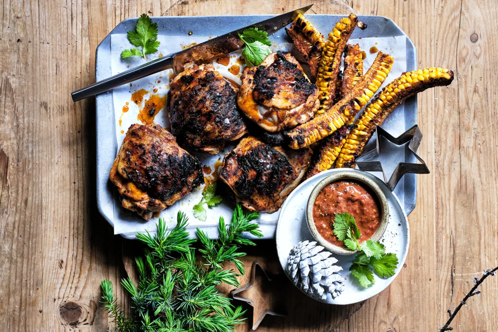BBQ menu ideas featuring grilled chicken, roasted corn, barbecue sides, fresh herbs, and flavorful dipping sauce.