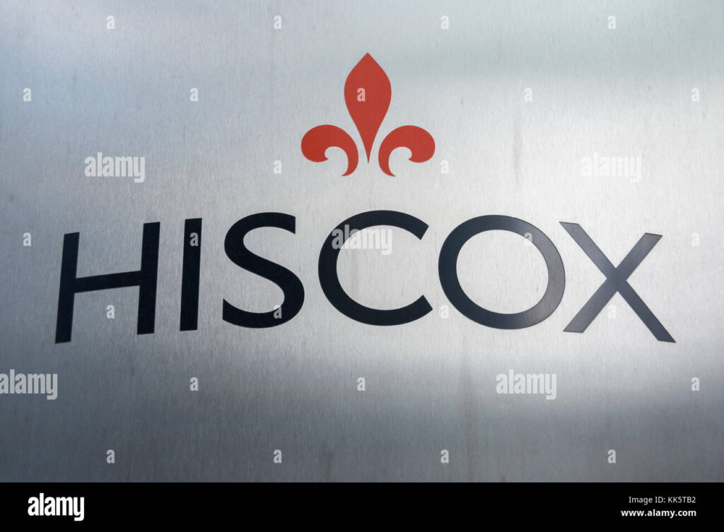 HSCOX insurance company logo with red emblem and large “HISCOX” text on a gray background. 