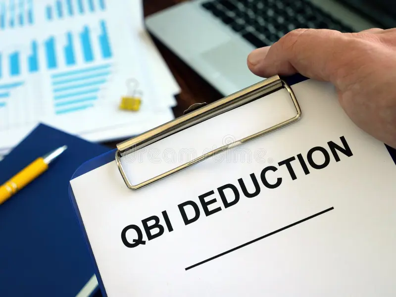 Which Businesses Do Not Qualify for the QBI Deduction? Illustration featuring a QBI deduction document, financial charts, calculator, and business tax planning materials.